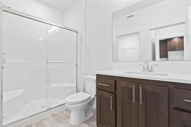 1912 NW 18th Ave, Battle Ground, WA 98604 - bathroom with vanity, toilet, a shower stall, and wood finished floors