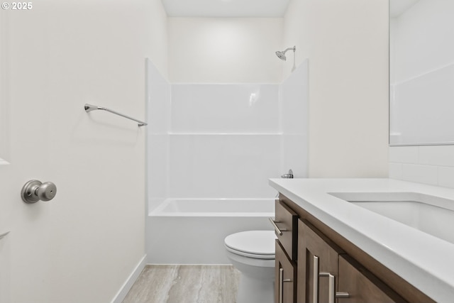 1912 NW 18th Ave, Battle Ground, WA 98604 - bathroom featuring shower / tub combination, wood finished floors, toilet, and vanity