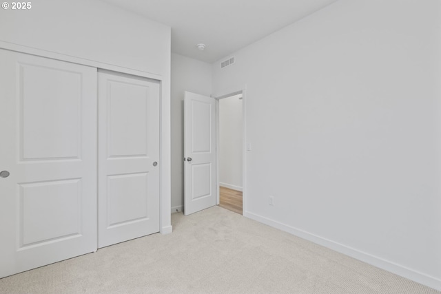 1912 NW 18th Ave, Battle Ground, WA 98604 - unfurnished bedroom featuring carpet flooring, baseboards, a closet, and visible vents
