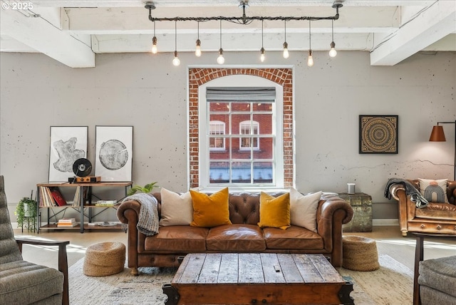 living room with wood finished floors and beam ceiling