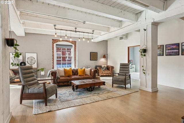 416 NW 13th Ave Unit 206, Portland, OR 97209 - living area featuring visible vents, beam ceiling, and wood finished floors