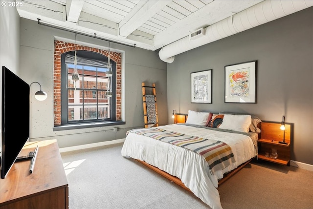 carpeted bedroom with wooden ceiling, baseboards, and beam ceiling