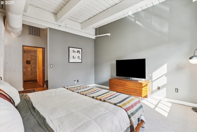 bedroom featuring visible vents, beam ceiling, and carpet flooring