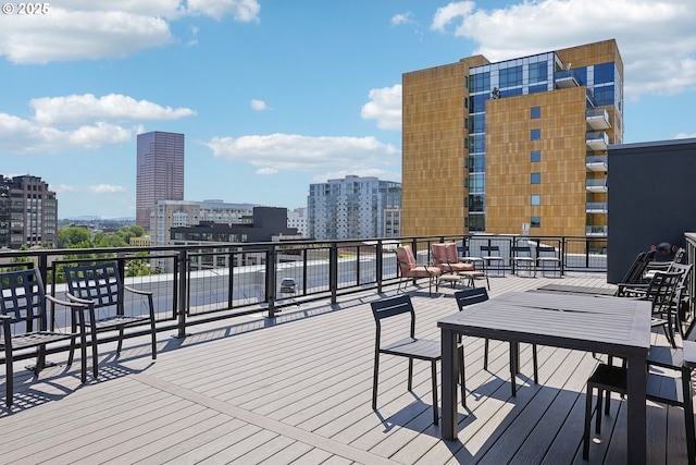 wooden terrace with a view of city