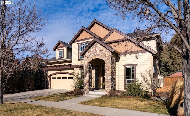 view of front facade featuring a garage and a front yard