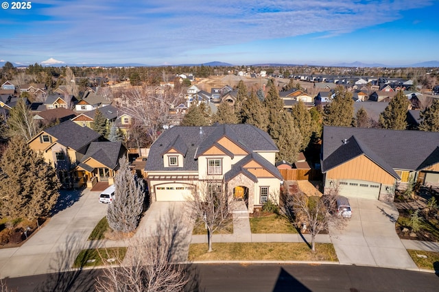 view of front of house with a garage and a mountain view