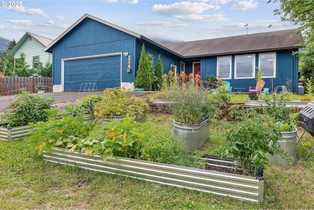 108 Watts Ave, Cascade Locks, OR 97014 - ranch-style home with a vegetable garden, an attached garage, and driveway
