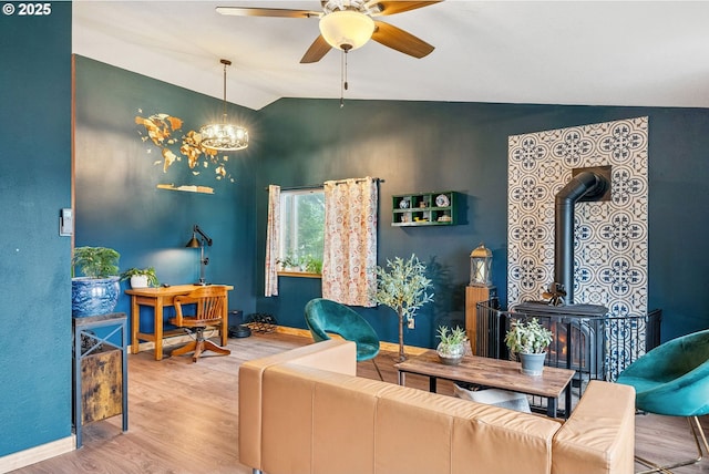 108 Watts Ave, Cascade Locks, OR 97014 - living area featuring lofted ceiling, wood finished floors, ceiling fan, a wood stove, and a chandelier
