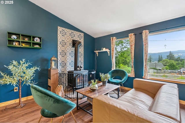 108 Watts Ave, Cascade Locks, OR 97014 - living room featuring a wood stove, vaulted ceiling, and wood finished floors