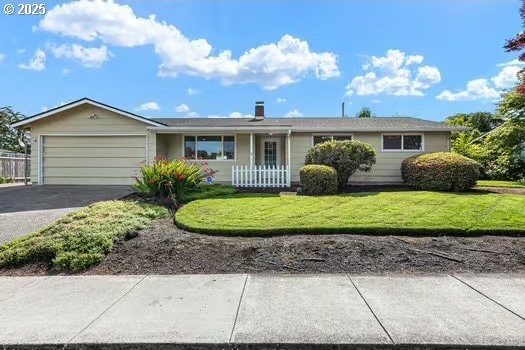 2065 Providence St, Eugene, OR 97401 - ranch-style home with an attached garage, driveway, and a front yard