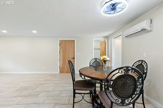 2065 Providence St, Eugene, OR 97401 - dining space with an AC wall unit and baseboards