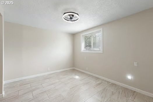 2065 Providence St, Eugene, OR 97401 - unfurnished room featuring a textured ceiling