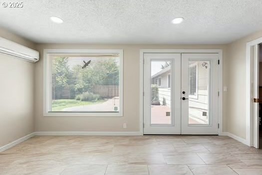 2065 Providence St, Eugene, OR 97401 - doorway featuring a textured ceiling, an AC wall unit, french doors, recessed lighting, and light tile patterned flooring