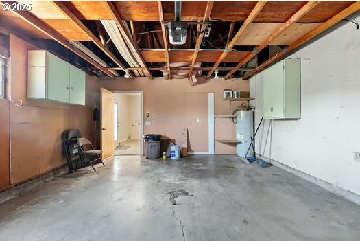 2065 Providence St, Eugene, OR 97401 - garage featuring strapped water heater