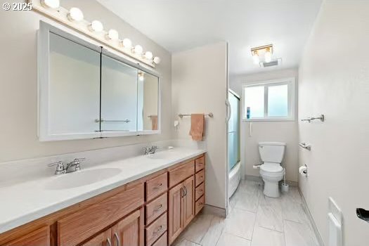 2065 Providence St, Eugene, OR 97401 - bathroom with double vanity, shower / bath combination with glass door, and marble finish floors