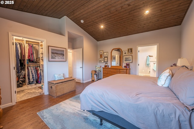 bedroom featuring wooden ceiling, dark wood-type flooring, vaulted ceiling, baseboards, and a spacious closet
