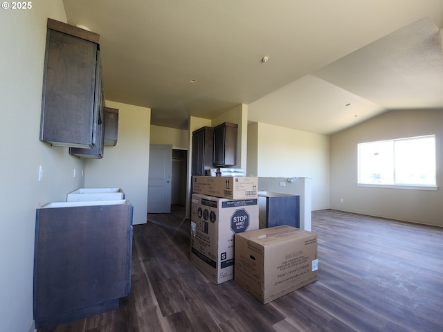 600 4th St, Gervais, OR 97026 - kitchen featuring dark wood-type flooring, vaulted ceiling, and dark brown cabinetry