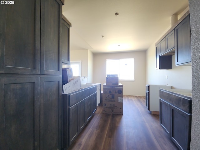 600 4th St, Gervais, OR 97026 - kitchen featuring dark wood-type flooring and washer / dryer