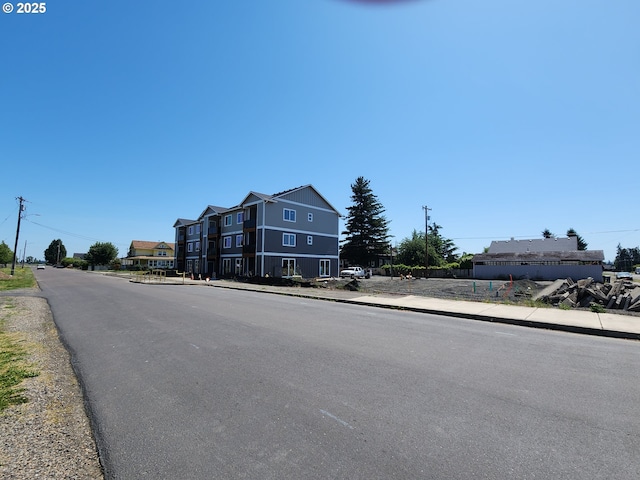 600 4th St, Gervais, OR 97026 - view of asphalt street with sidewalks, street lights, and curbs