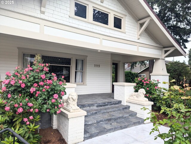 view of exterior entry featuring a porch