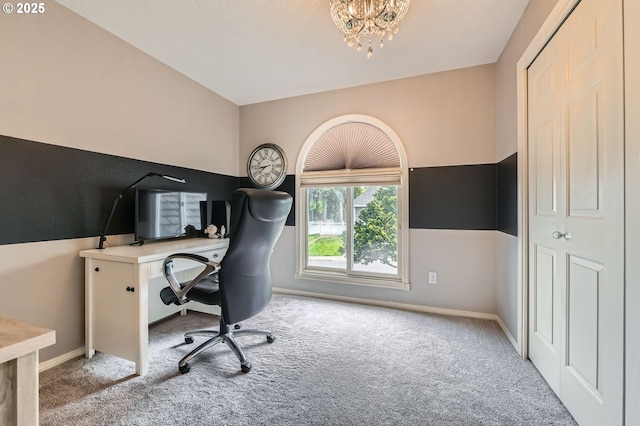 office area with light colored carpet, a chandelier, and baseboards