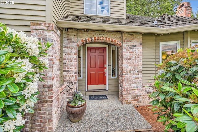 entrance to property with brick siding