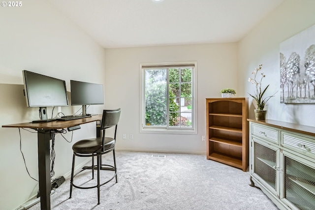 office with light carpet and baseboards