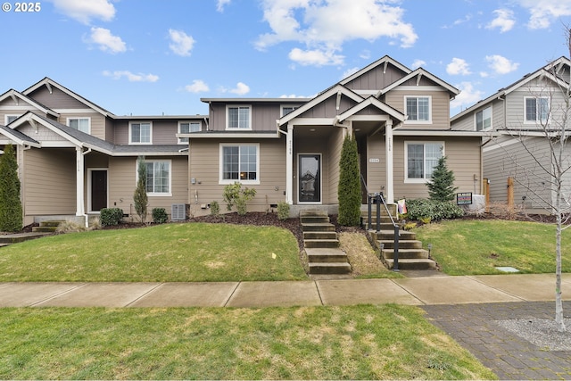 craftsman-style house featuring board and batten siding and a front yard