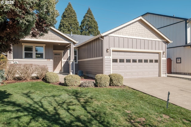 view of front of home with a garage, driveway, a front lawn, and board and batten siding