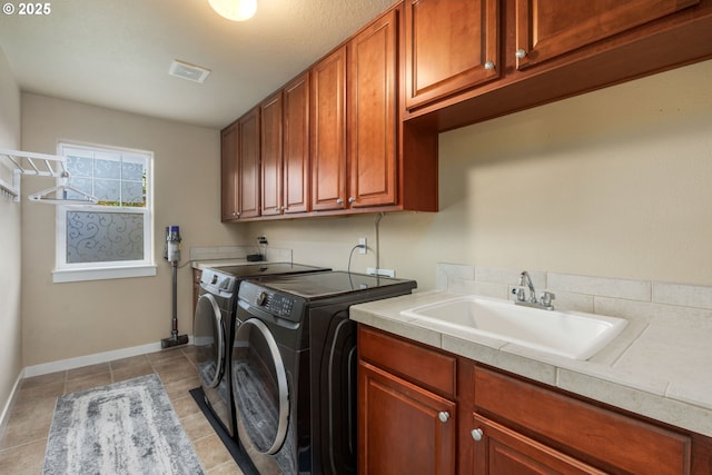 14956 SE Pebble Beach Dr, Happy Valley, OR 97086 - laundry room featuring washing machine and dryer, cabinet space, and light tile patterned floors