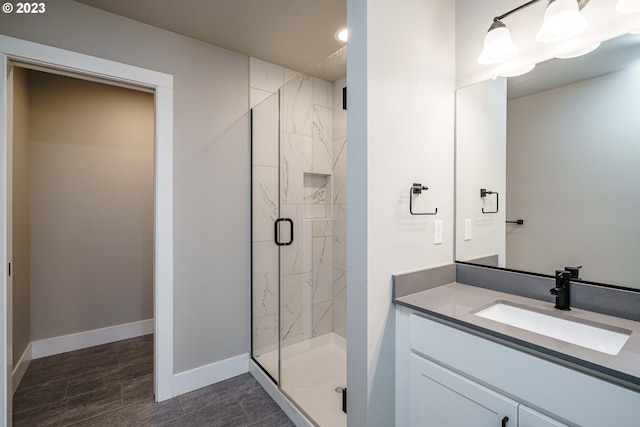 304 N Bridgeton Rd, Portland, OR 97217 - bathroom featuring a marble finish shower, vanity, wood finished floors, and recessed lighting