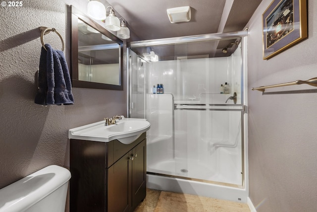 703 NW 94th St, Vancouver, WA 98665 - full bath featuring a stall shower, vanity, and a textured wall