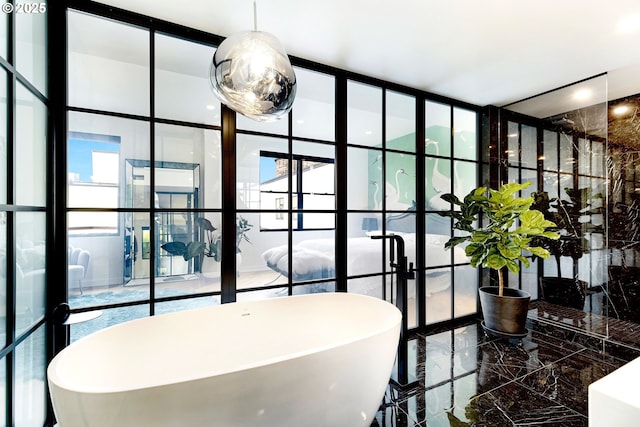 full bathroom featuring marble tiled flooring, floor to ceiling windows, and a soaking tub