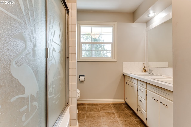 488 Pinto Way, Eugene, OR 97401 - bathroom with vanity, baseboards, decorative backsplash, toilet, and tile patterned flooring