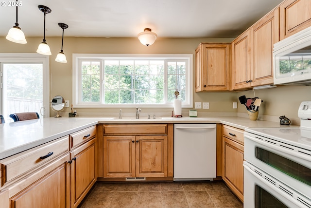 488 Pinto Way, Eugene, OR 97401 - kitchen featuring white appliances, a sink, plenty of natural light, and hanging light fixtures