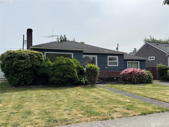 2727 Maple St, Longview, WA 98632 - ranch-style home featuring a front lawn, brick siding, and a shingled roof