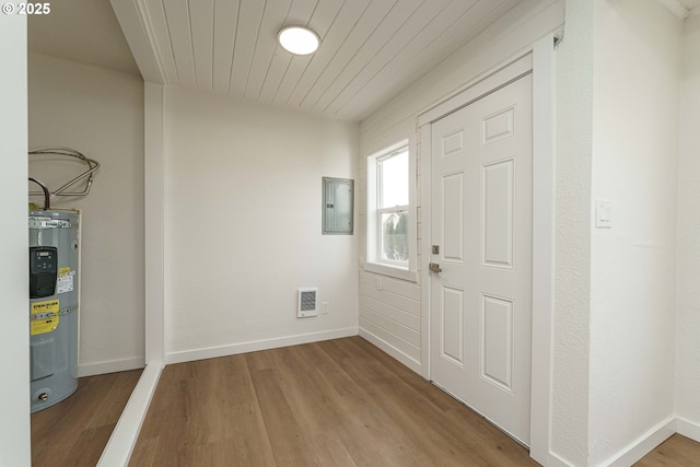 entrance foyer featuring wood ceiling, electric panel, water heater, and light wood-type flooring