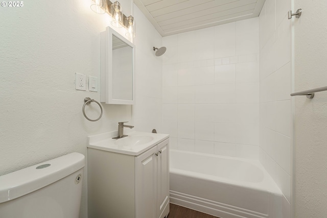 full bathroom with vanity, toilet, and tiled shower / bath combo