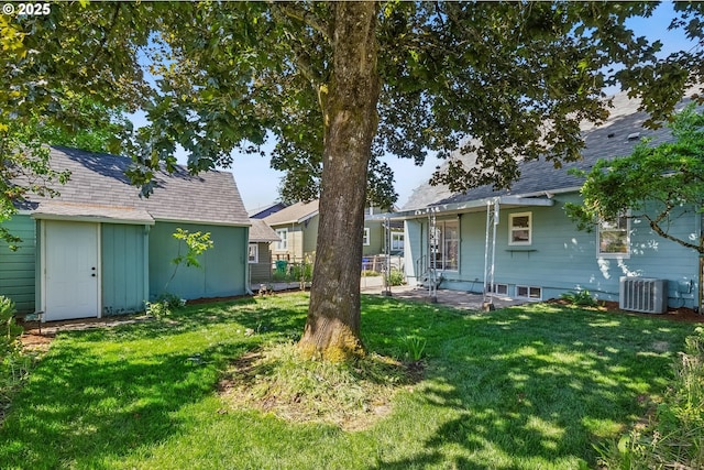 3330 SE 66th Ave, Portland, OR 97206 - view of green lawn featuring central AC, a patio, and an outdoor structure