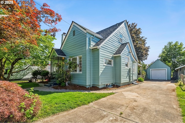 3330 SE 66th Ave, Portland, OR 97206 - view of home's exterior featuring an outbuilding, a detached garage, concrete driveway, and a shingled roof