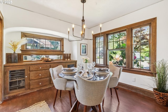 3330 SE 66th Ave, Portland, OR 97206 - dining room with dark wood-style flooring, plenty of natural light, a chandelier, and baseboards
