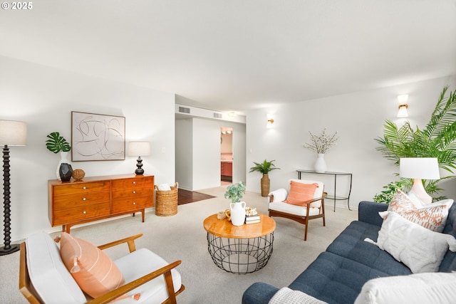 living room with light colored carpet