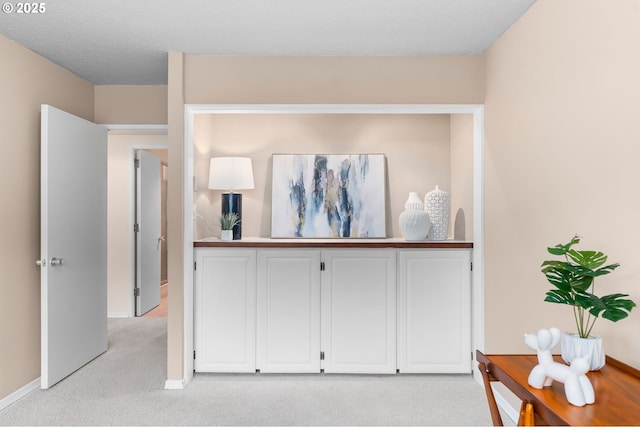 2323 SW Park Pl Unit 603, Portland, OR 97205 - hall featuring light colored carpet and baseboards