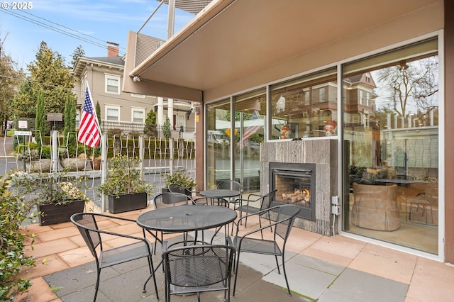 view of patio / terrace featuring a tiled fireplace