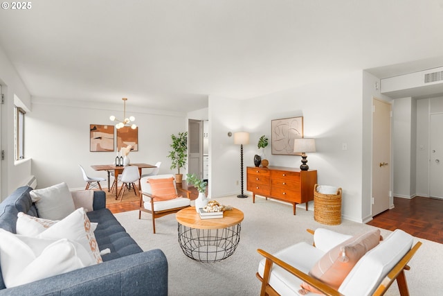 2323 SW Park Pl Unit 603, Portland, OR 97205 - living area with baseboards and a chandelier