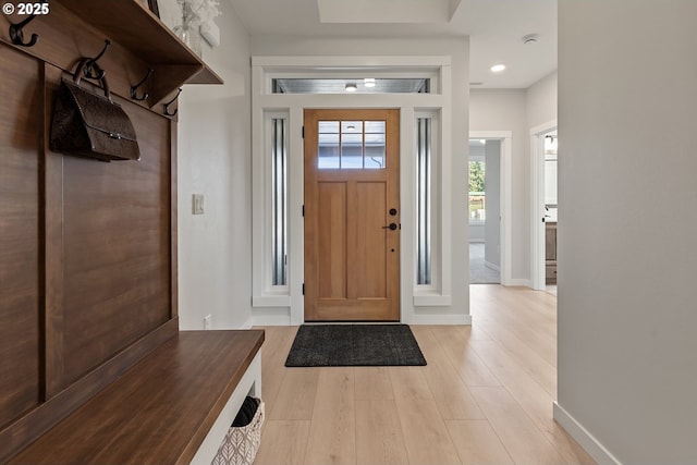 foyer featuring recessed lighting, baseboards, and light wood-style floors