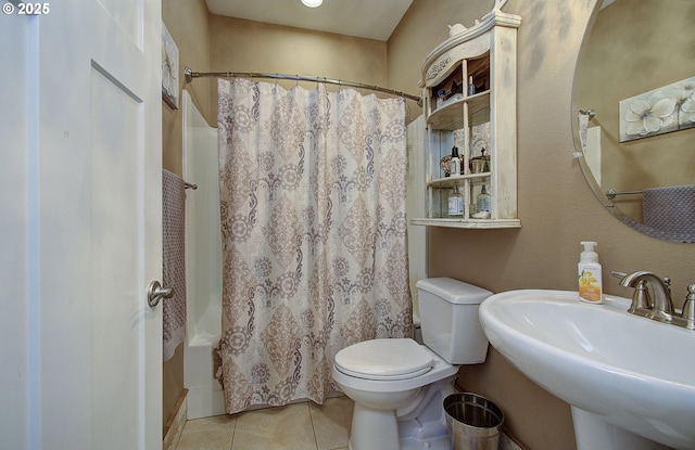 full bathroom with tile patterned flooring, sink, shower / tub combo with curtain, and toilet