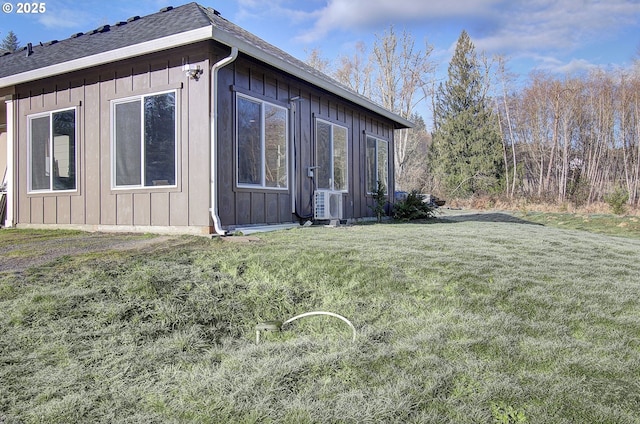 view of side of home featuring a yard