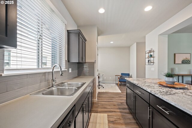 14139 SW Burlwood Ln, Beaverton, OR 97005 - kitchen featuring light countertops, recessed lighting, dark wood-type flooring, and backsplash