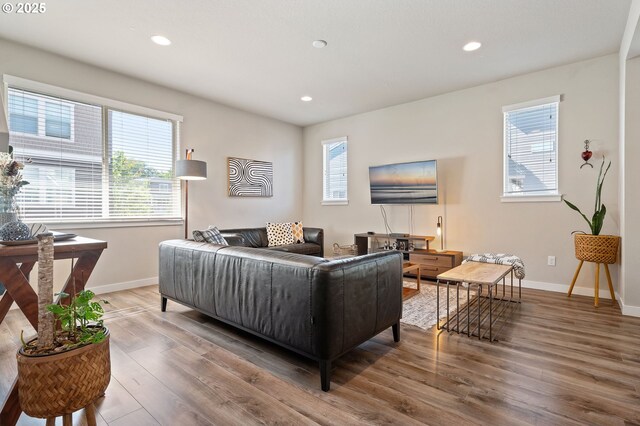 14139 SW Burlwood Ln, Beaverton, OR 97005 - living area featuring wood finished floors and recessed lighting